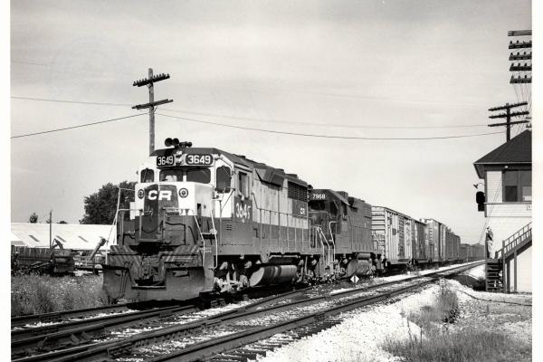 Photograph of GP35 3649 and GP38-2 7968 on train CM96 at Sterling OH. 7/24/77