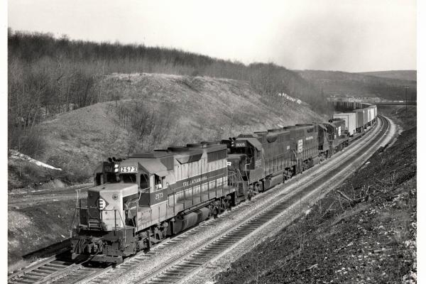 Photograph of GP35 2573, GP38-2 8005 and two more units on TV79 at Tunnel Hill PA. 2/8/77