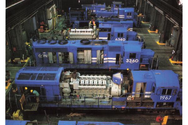 Promotional photo: Conrail locomotives receive repairs at the Juniata Locomotive Shop, Altoona PA., one of the world's largest railroad shops.