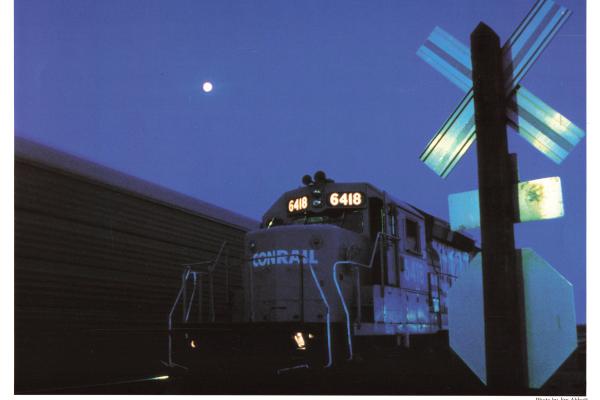 Promotional photo: An SD40-2 moves at night near Columbus, Ohio.