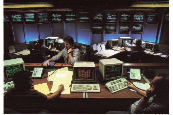 Promotional photo: Computer Assisted Train Dispatching (CATD), recently installed at seven Conrail locations, provides dispatchers with visual displays of train movements (background) for safer, more efficient train operations.