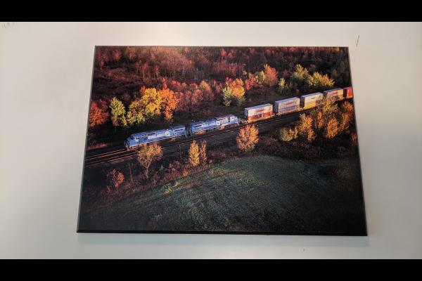 Wood Laminated Promotional photo: Twin General Electric C40-8 wide-cab units lead a Conrail double-stack train over the railroad's main East-West route through New York at Oneida.
