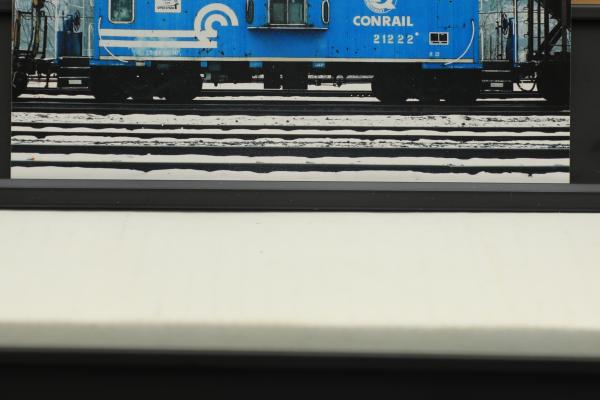 Color photo of N-21 caboose #21222 in Quality paint scheme with logo