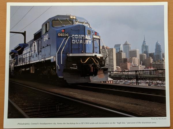 Promotional photo: Philadelphia, Conrail's headquarters city, forms the backdrop for a GE C40-8 wide-cab locomotive on the 'high line,' just west of the downtown area.