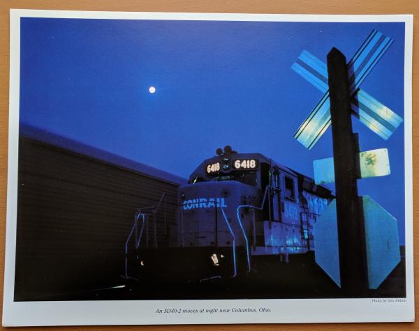 Promotional photo: An SD40-2 moves at night near Columbus, Ohio.