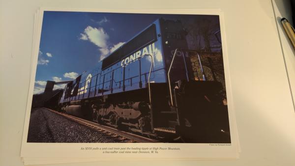 Promotional photo: An SD50 pulls a unit coal train past the loading tipple at High Power Mountain, a low-sulfur coal mine near Drennen, W.Va.