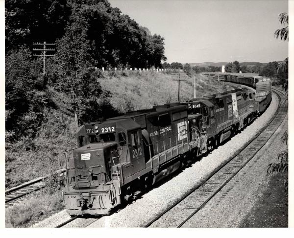 Photograph of GP35 2312, GP38-2 8045 and an ex-EL GP35 westbound at Smithboro NY. 9/26/76