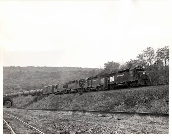 Photograph of GP40 3131, GP38-2 7997, GP38 7743, and U23B 501 at Marysville PA. 11/16/76