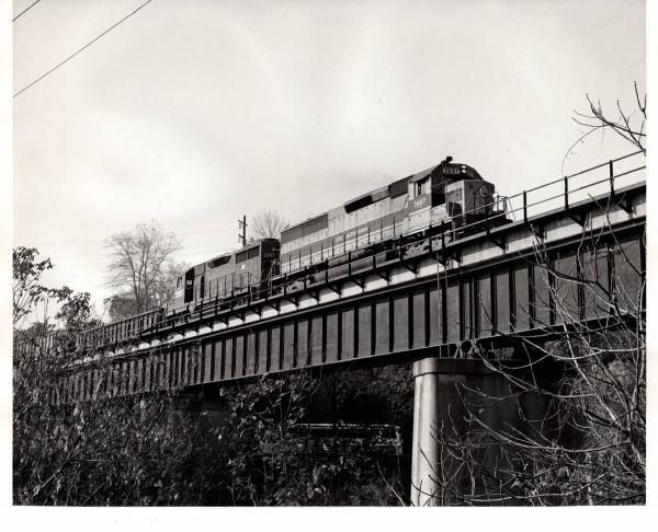Photograph of SD45-2 3667 and GP35 2267 on train HB-8 at Reading PA. 10/22/76