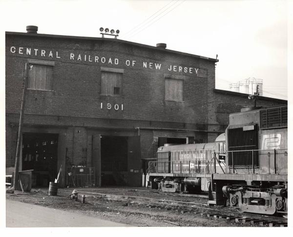 Photograph of unknown RS11 and former LV RS3 at E Port Shops. 10/31/76