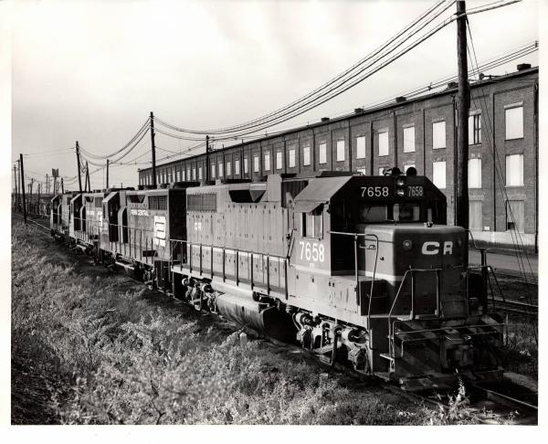 Photograph of ex-LV GP38AC 7658, GP35 2301 and two more EMD units at E Port. 10/31/76