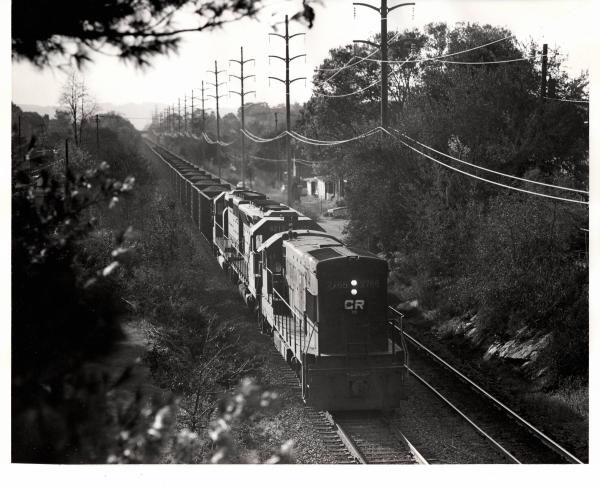 Photograph of U23B 2765, SD45 6213 and another EMD on an eastbound coal train at Reading PA. 10/21/76