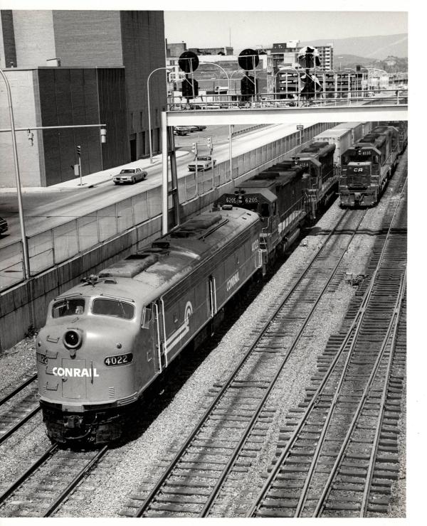 Photograph of E8 4022, SD45 6205 and SD45 6158 on Train #9 in Altoona PA. 5/28/77