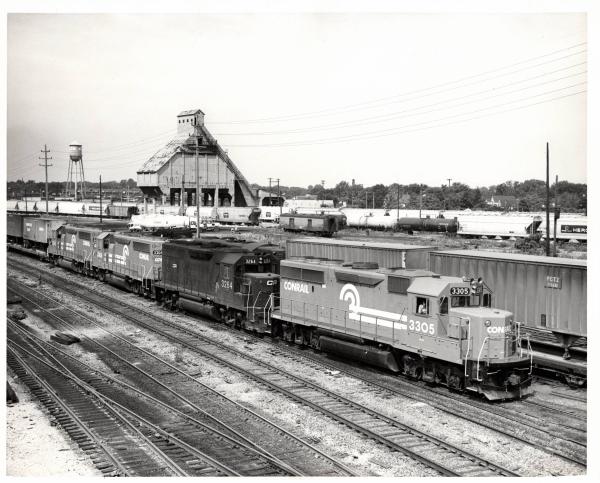 Photograph of GP40-2 3305, GP40 3264, GP40-2 3306 and an unknown GP40-2 in Collinwood Yard, Cleveland OH. 7/23/77