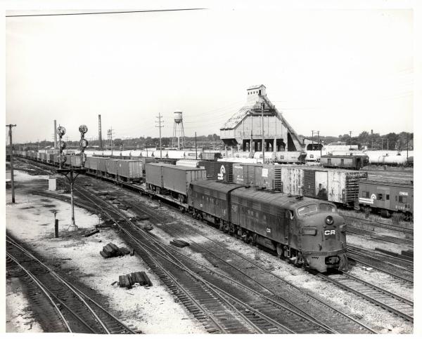 Photograph of FP7 4360 and F7 4345 in Collinwood Yard, Cleveland OH. Also shows N7E caboose 21143. 7/24/77.