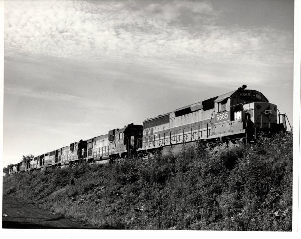 Photograph of SD45-2 6665, C630 6755 and others at Hudson OH. 7/23/77