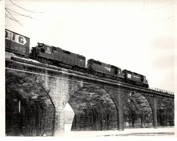 Photograph of GP35 2349, GP38 8108 and a borrowed Missouri Pacific GP35 crossing Rockville Bridge. 1/8/77