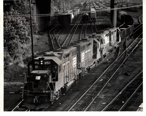 Photograph of GP38-2 8152, GP35 2351, GP35 3615 and another unknown GP unit leaving Enola Yard westbound. 6/76