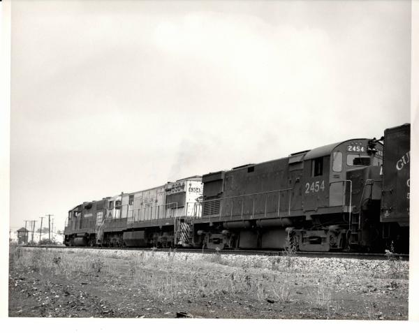 Photograph of C424 2454, U28C 6304 and an unknow GP38-2 at Orrville OH. 7/30/76