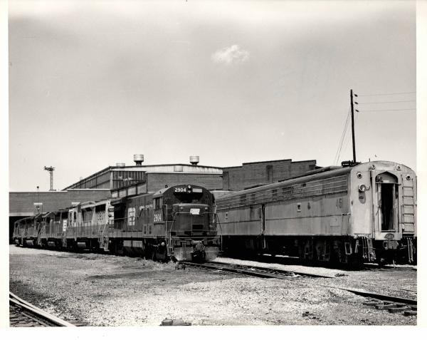 Photograph of U30B 2904, GP30 3607 and other locomotives at the Harrisburg Engine Shops. 7/76