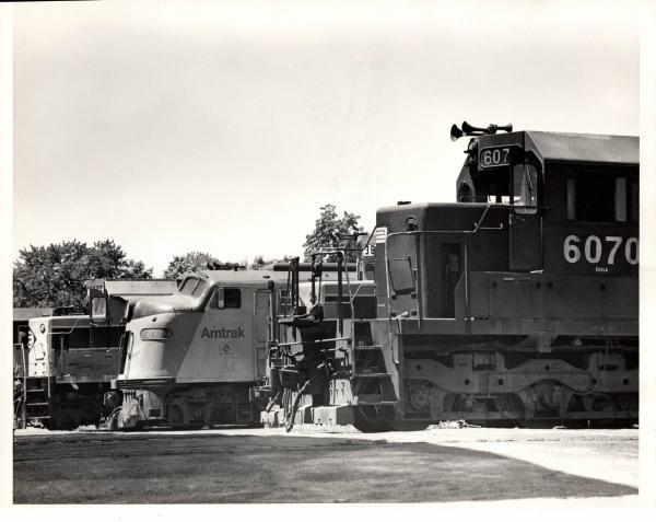 Photograph of SD40 6070 and other units at Harrisburg PA. 7/76