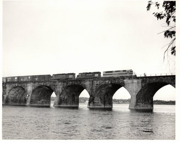 Photograph of SDP45 3645, a GP40 and SD45 6142 crossing Rockville Bridge. 5/76