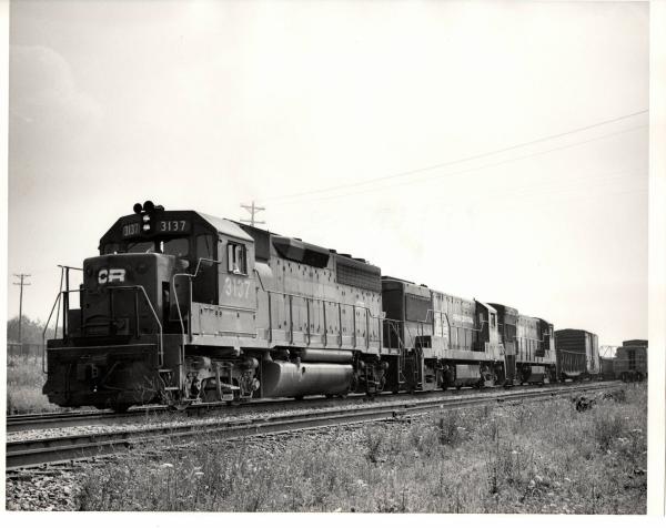 Photograph of GP40 3137, U25B 2626 and an unkniwn U23B at Orrville OH. 7/30/76