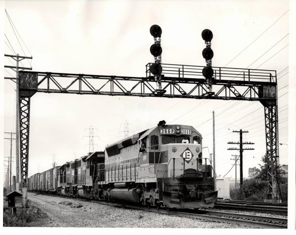 Photograph of SDP45 3668, GP38-2 8005 and another GP38-2 east of Cleveland OH. 7/31/76