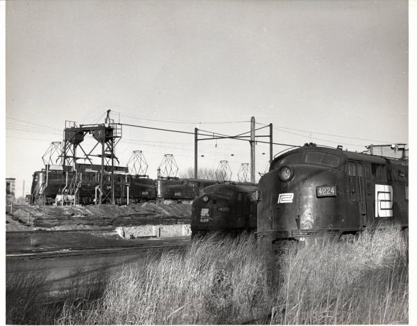 Photograph of E7 4224, E8 4324, GG1 4881 and GG1 4882 at South Amboy NJ. 12/5/76.