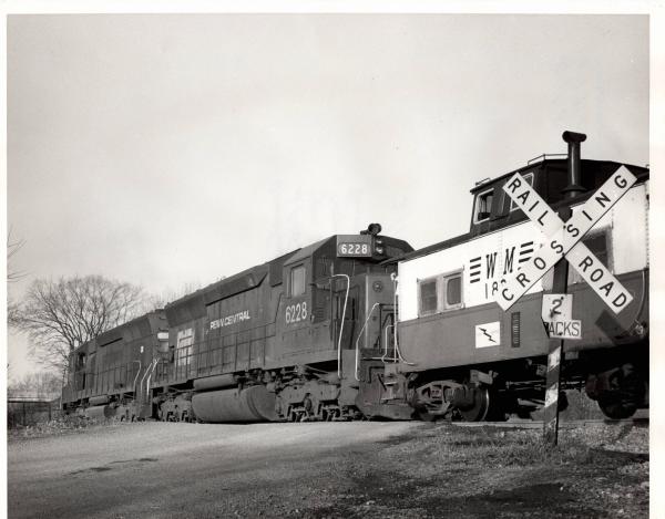 Photograph of SD45 6228 and another SD45 shoving a Western Maryland train at Hagerstown MD. 2/15/77