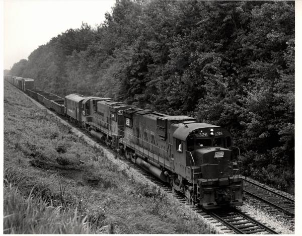Photograph of C630 6326, another C630 and an F7 at Hudson OH. 7/30/76