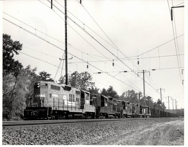 Photograph of GP9 7189, GP9 7238 and three more units on a Southbound Morgantown Turnaround coal train at Baltimore MD. 7/3/77