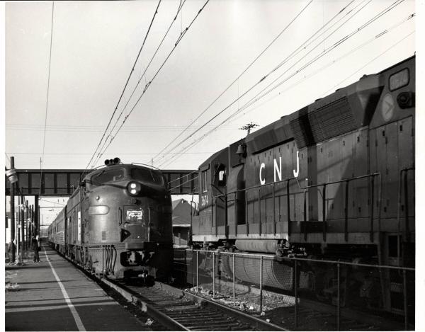 Photograph of GP40P 3674 and an unknown E8 at South Amboy NJ. 12/5/76