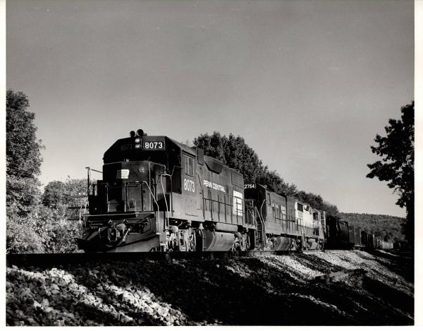 Photograph of GP38-2 8073, U23B 2754 and an unknown GP30 at Endicott NY. 9/27/76