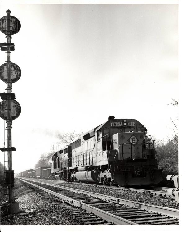 Photograph of SD45-2 3667 eastbound out of Reading with train HB-8. 10/22/76