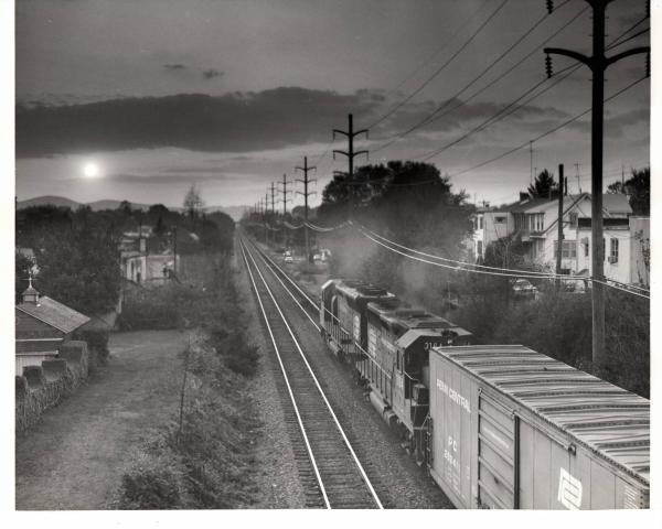 Photograph of GP40 3164 and an unknown SD45 westbound out of Reading. 10/21/76