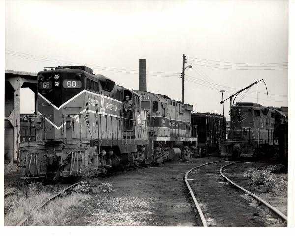 Photograph of BAR GP7 68 and C424 2414 and a GP18 at East 55th St Yard in Cleveland OH. 7/31/76