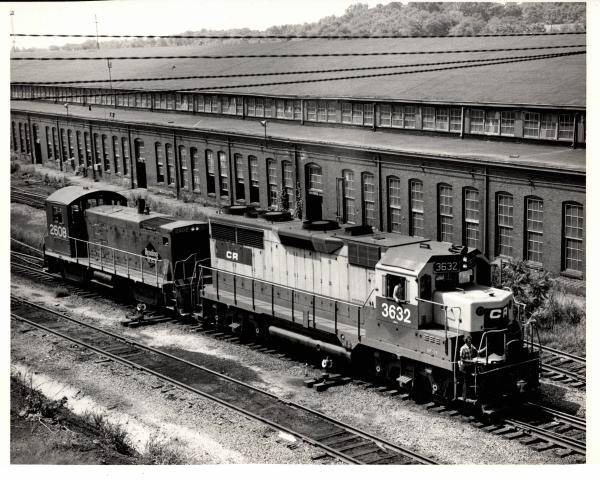 Photograph of GP35 6362 and SW1001 2608 at Rutherford Yard. 7/76