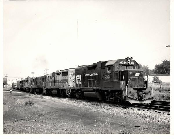 Photograph of GP38-2 8024, GP35 2578 and three more units at Orrville OH. 7/30/76