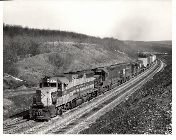 Photograph of GP35 2573, GP38-2 8005 and two more units on TV79 at Tunnel Hill PA. 2/8/77