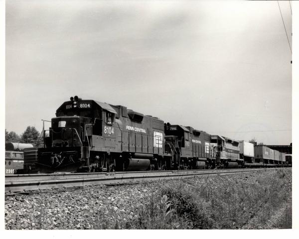 Photograph of GP38-2 8104, GP38-2 7992 and SDP45 3665 westbound at Cresson PA. 6/76