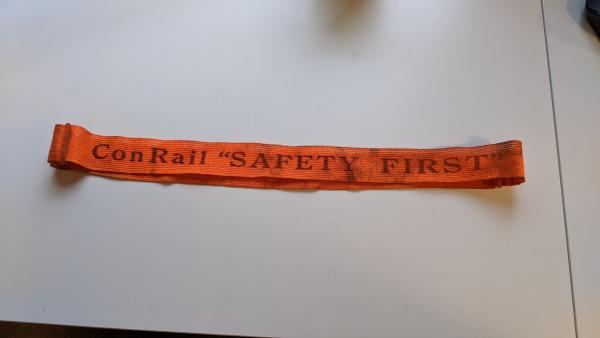 Orange ConRail Safety First strap (worn)