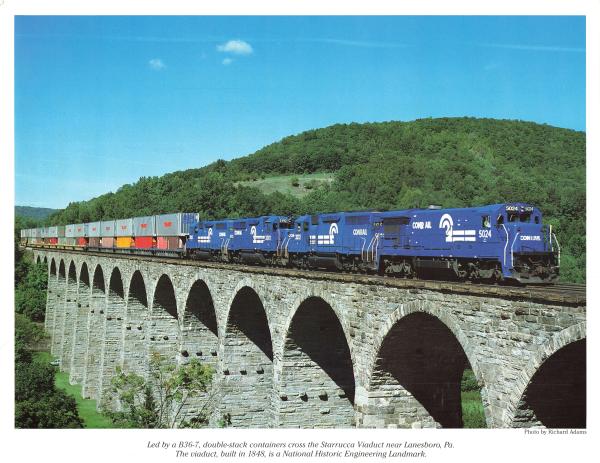 Promotional photo: Led by a B36-7, double-stack containers cross the Starrucca Viaduct near Lanesboro, Pa. The viaduct, built in 1848, is a National Historic Engineering Landmark.