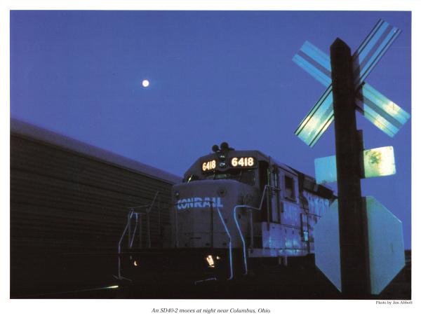Promotional photo: An SD40-2 moves at night near Columbus, Ohio.