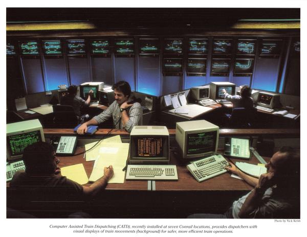 Promotional photo: Computer Assisted Train Dispatching (CATD), recently installed at seven Conrail locations, provides dispatchers with visual displays of train movements (background) for safer, more efficient train operations.