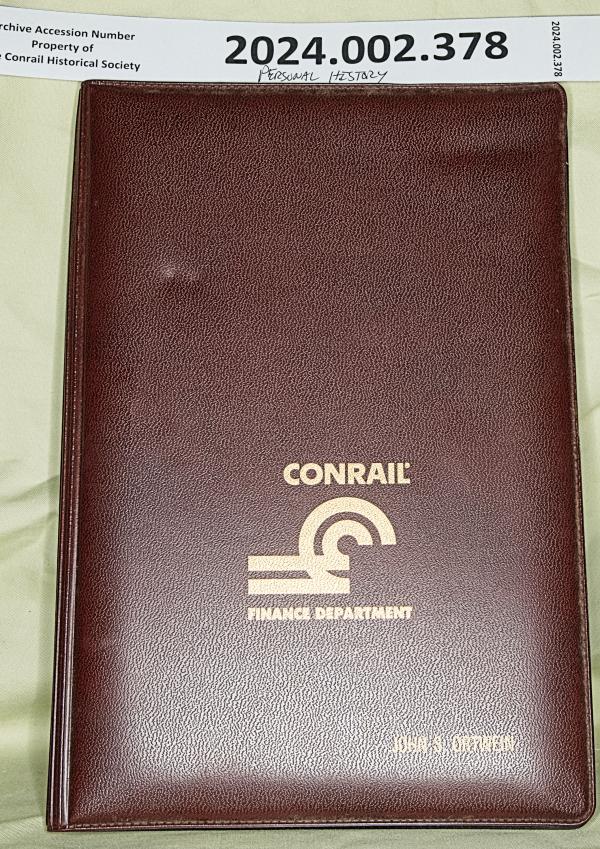 CR Finance Dept notepad holder & note John S. Ortwein