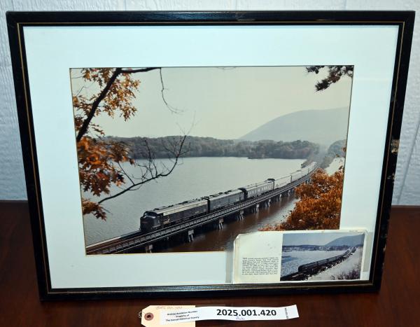 Framed color photo of bridge over Doodletown Bight with northbound CR OCS train 1988