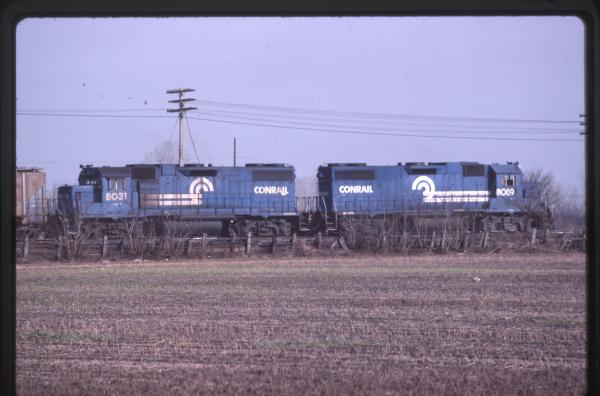 Photo of EMD GP38-2 8031, 8089 in Walbridge, OH on 12/16/1984