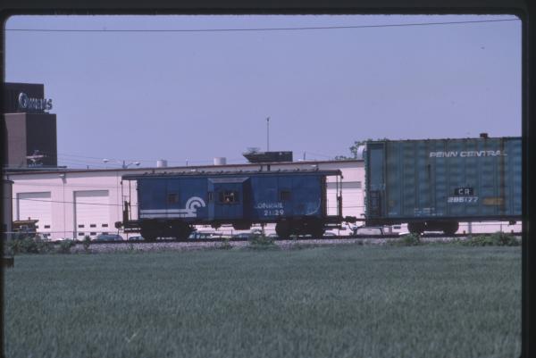 Photo of N7D Class Caboose 21129 in Northwood, OH on 5/1985