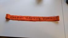 Orange ConRail Safety First strap (worn)